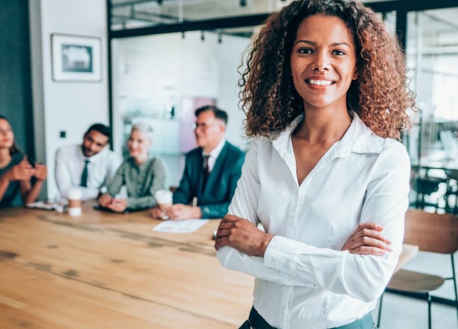 Woman in front of a boardroom table